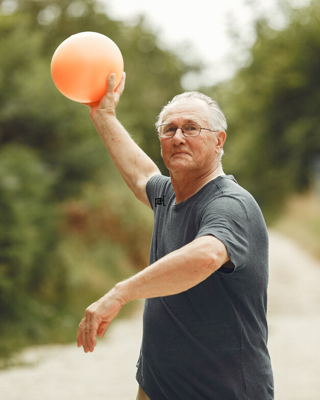 an older gentleman holding a basketball